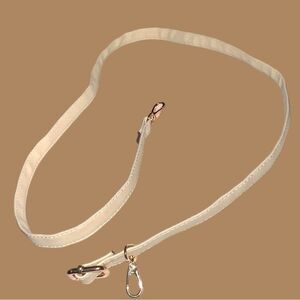 Light beige or cream colored bag shoulder or crossbody strap. Gold hardware. New